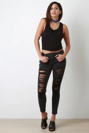 Mid-Rise Distress Skinny Jeans