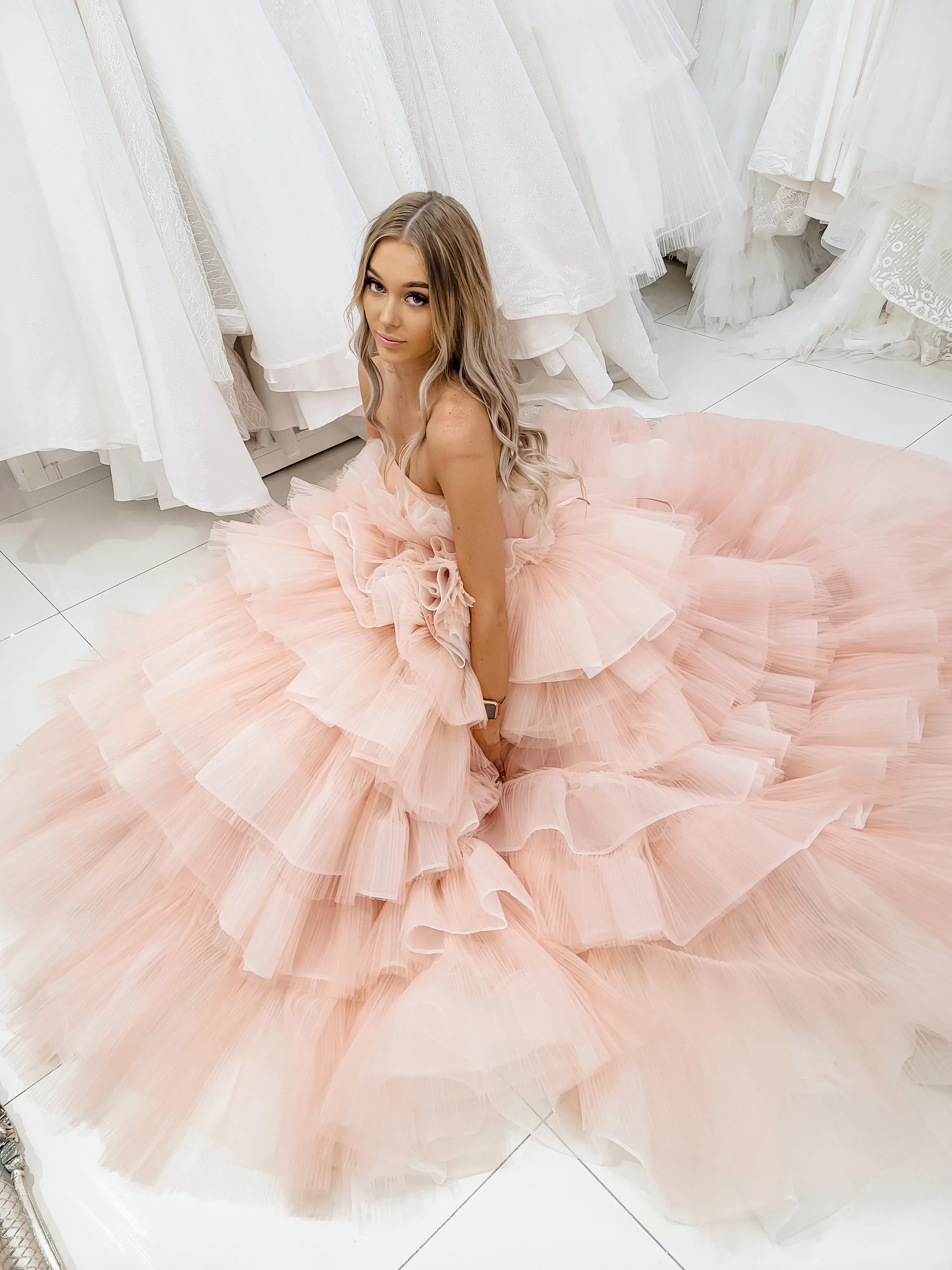 Nudish pink with a bushier top and a bushier puffy layered skirt.