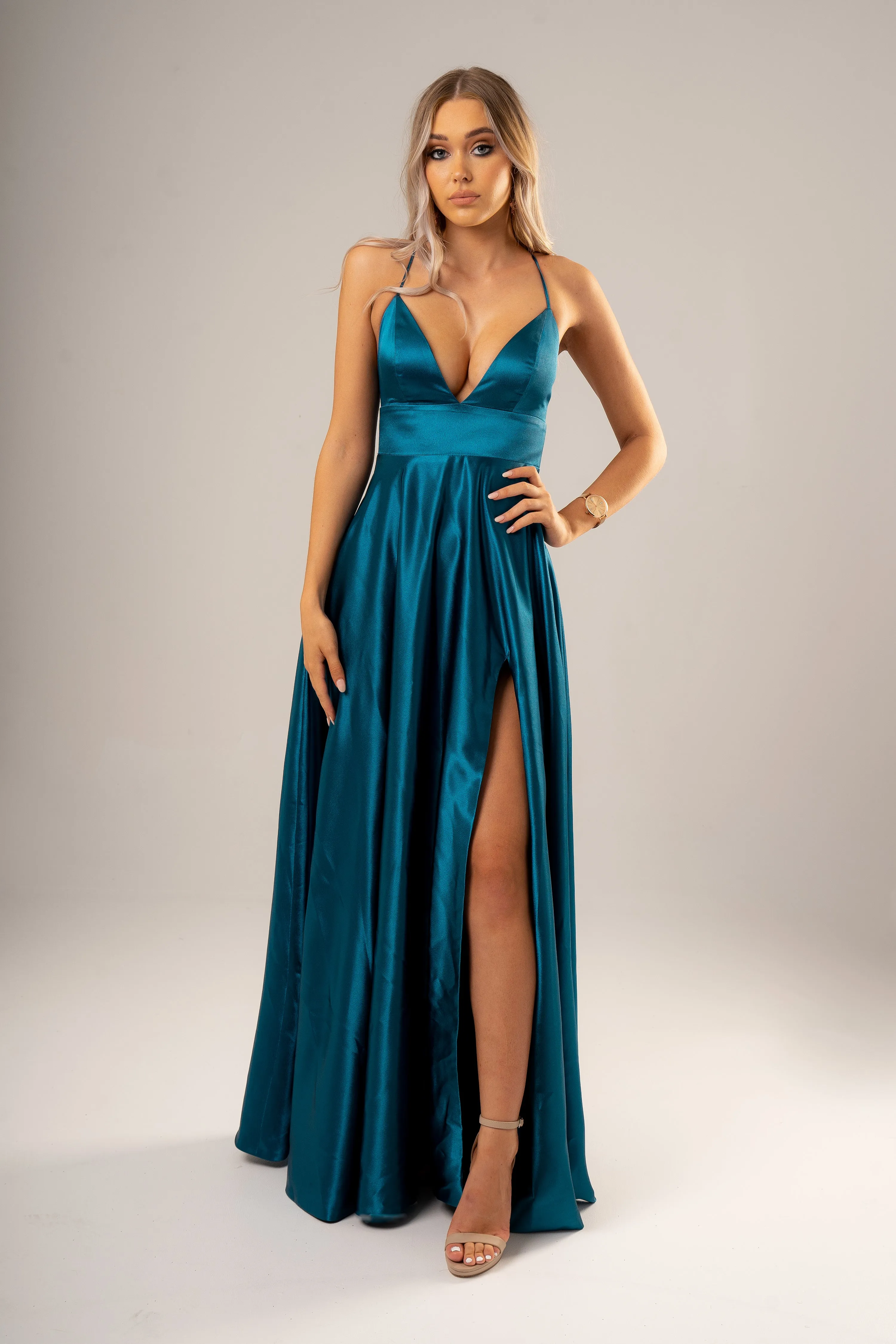 Teal deep v cut neckline with a slit and lace up back