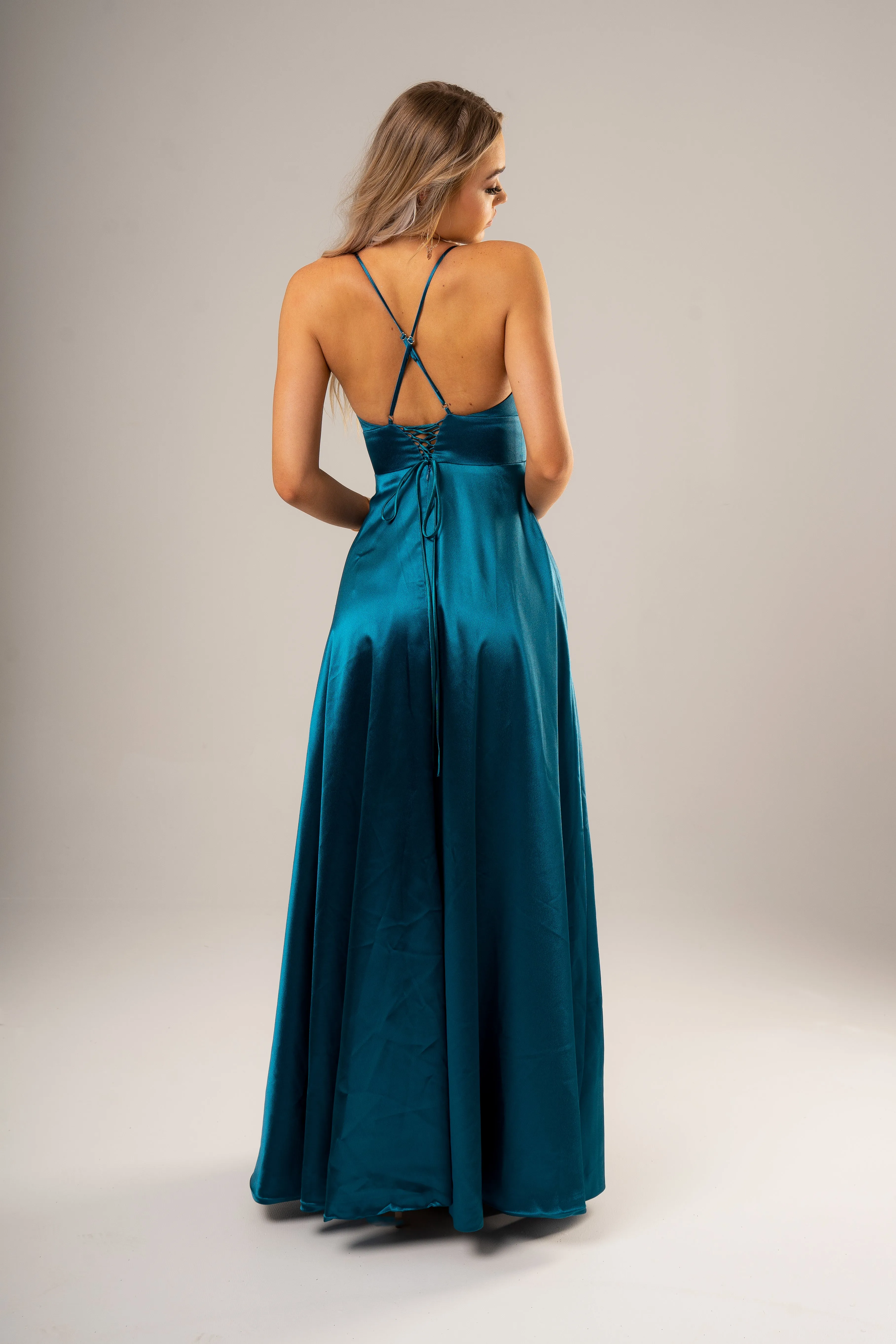 Teal deep v cut neckline with a slit and lace up back